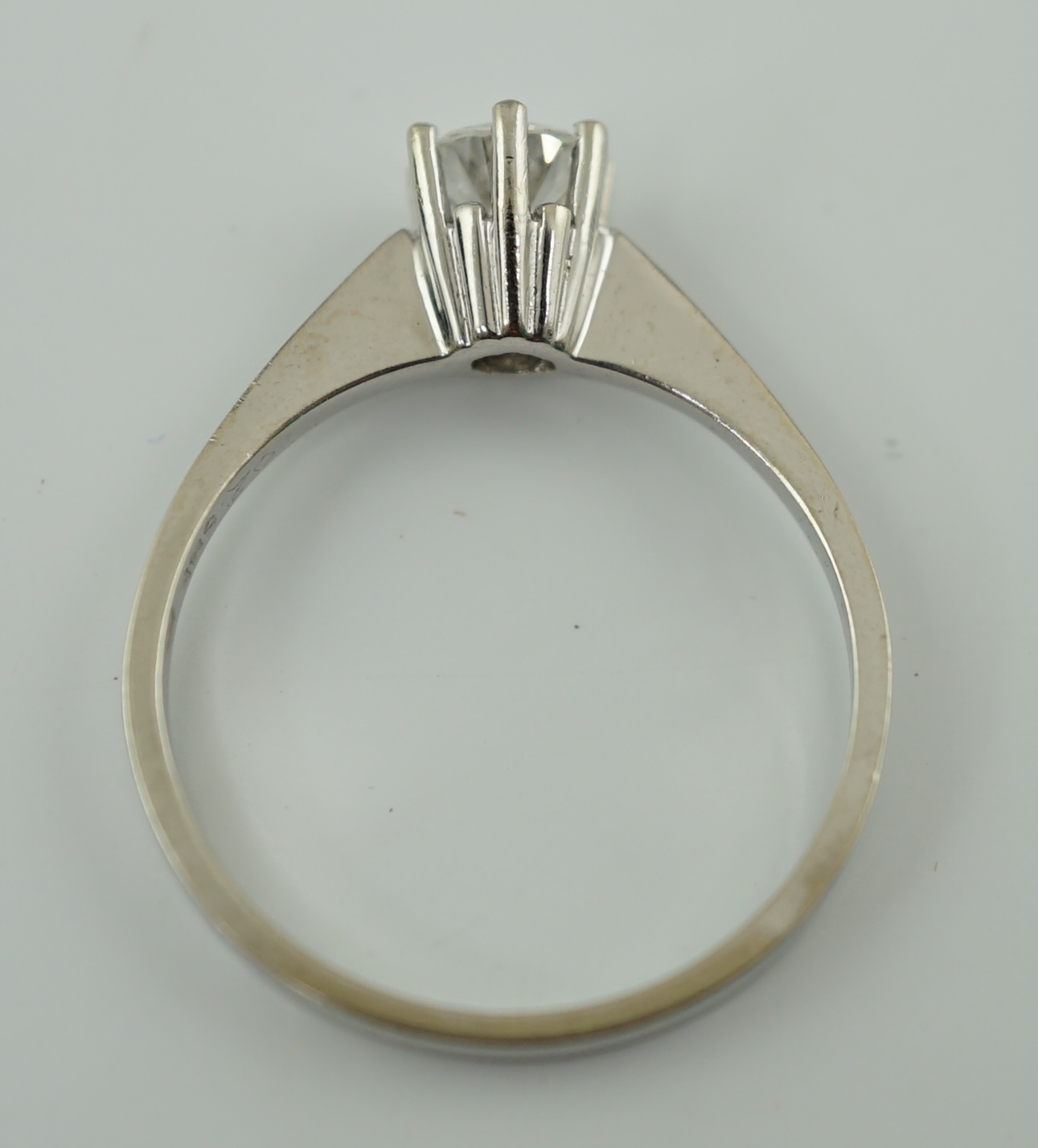 A modern 14k gold and solitaire diamond set ring